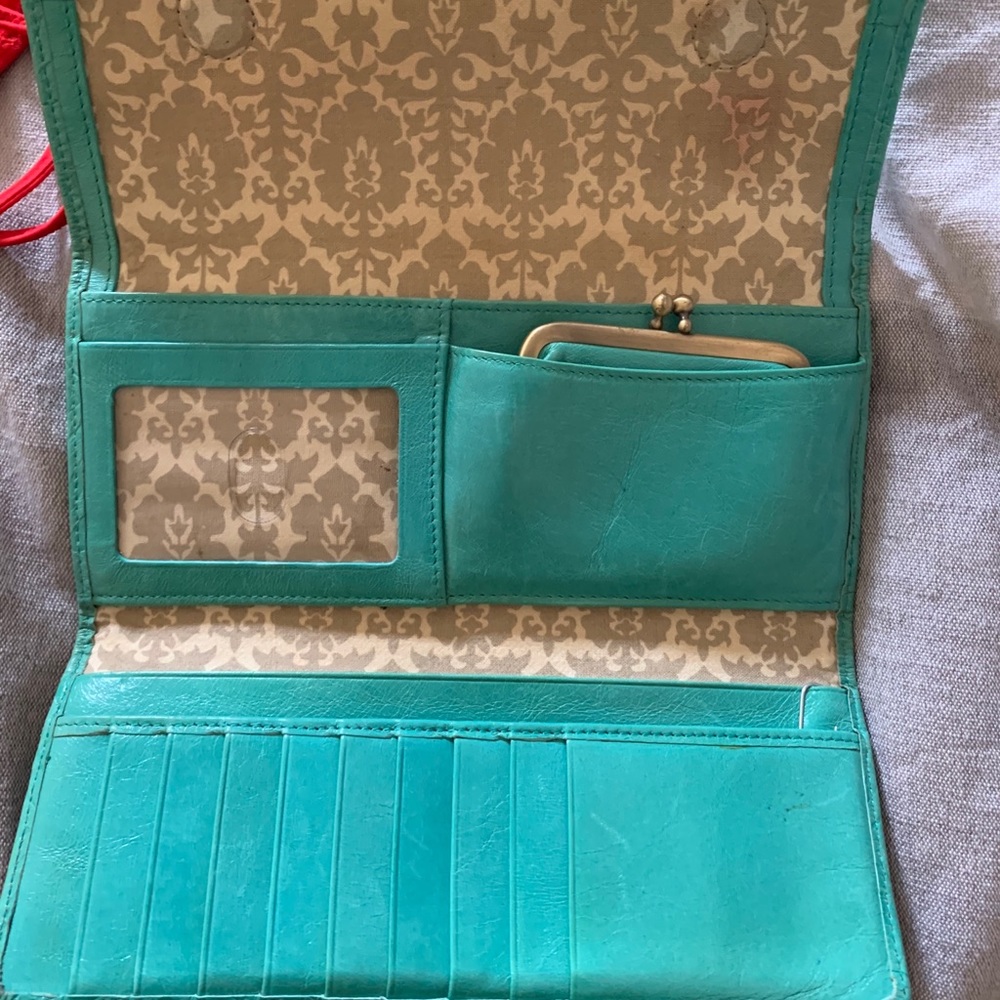Teal embossed hobo international wallet